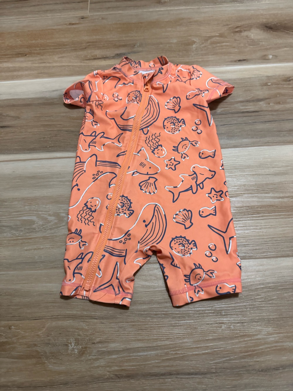 Carter’s orange sea creature rash guard